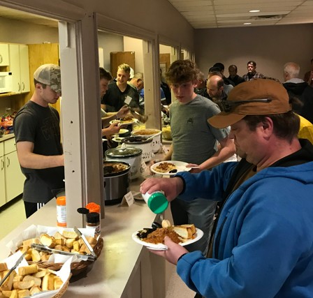 Men's retreat men in meal line